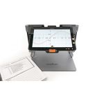 The Connect 12 smart portable magnifier viewing an online document of a math graph next to a textbook.