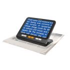 Image of exploré 8 on its built-in stand showing the white text on a blue background color contrast option to read a newspaper.